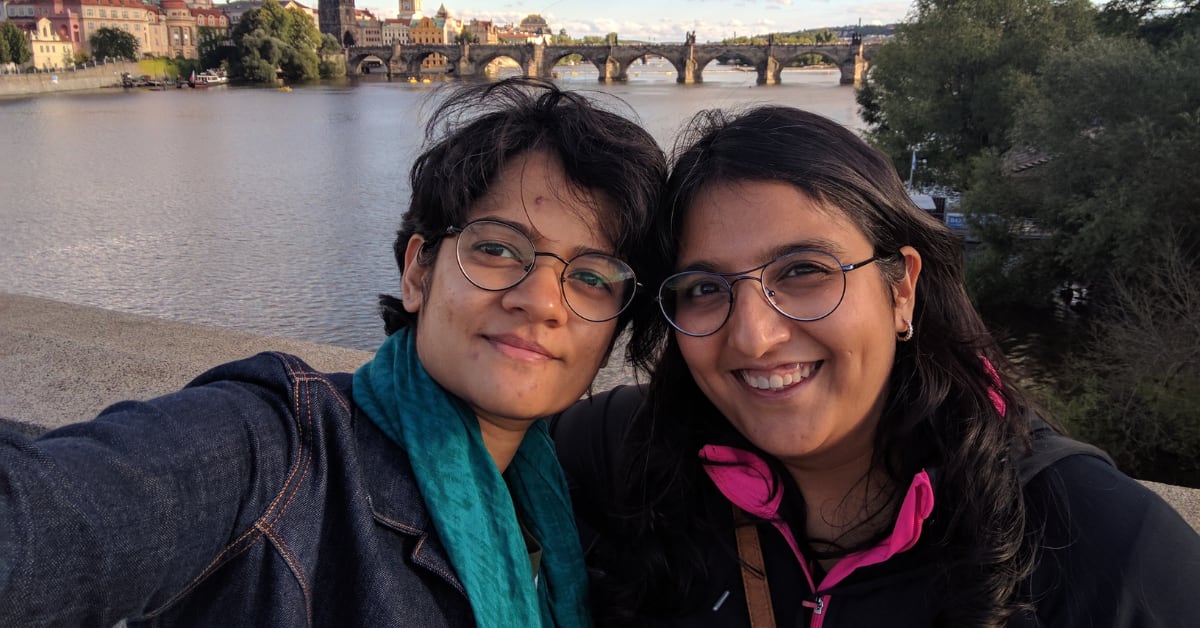 Filmmaker Aditi Anand and partner Susan Dias smiling together with their son in India