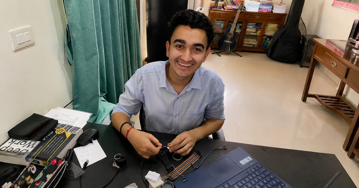 Teenage boy Arnav Maharishi working on laptop creating technology for paralysis rehabilitation