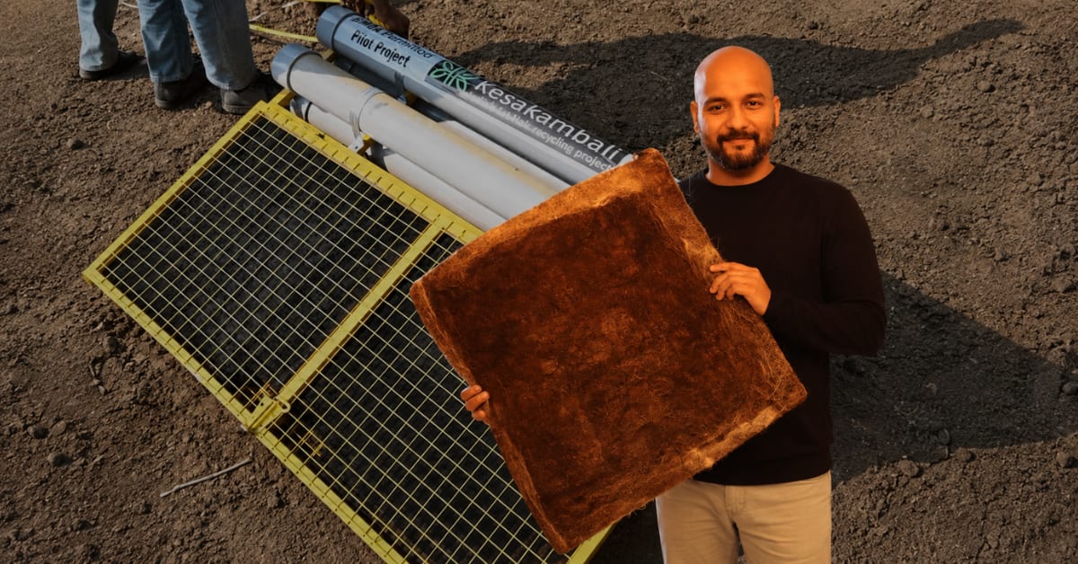 Brown fibrous mats made from recycled human hair placed in polluted drainage canal in Delhi