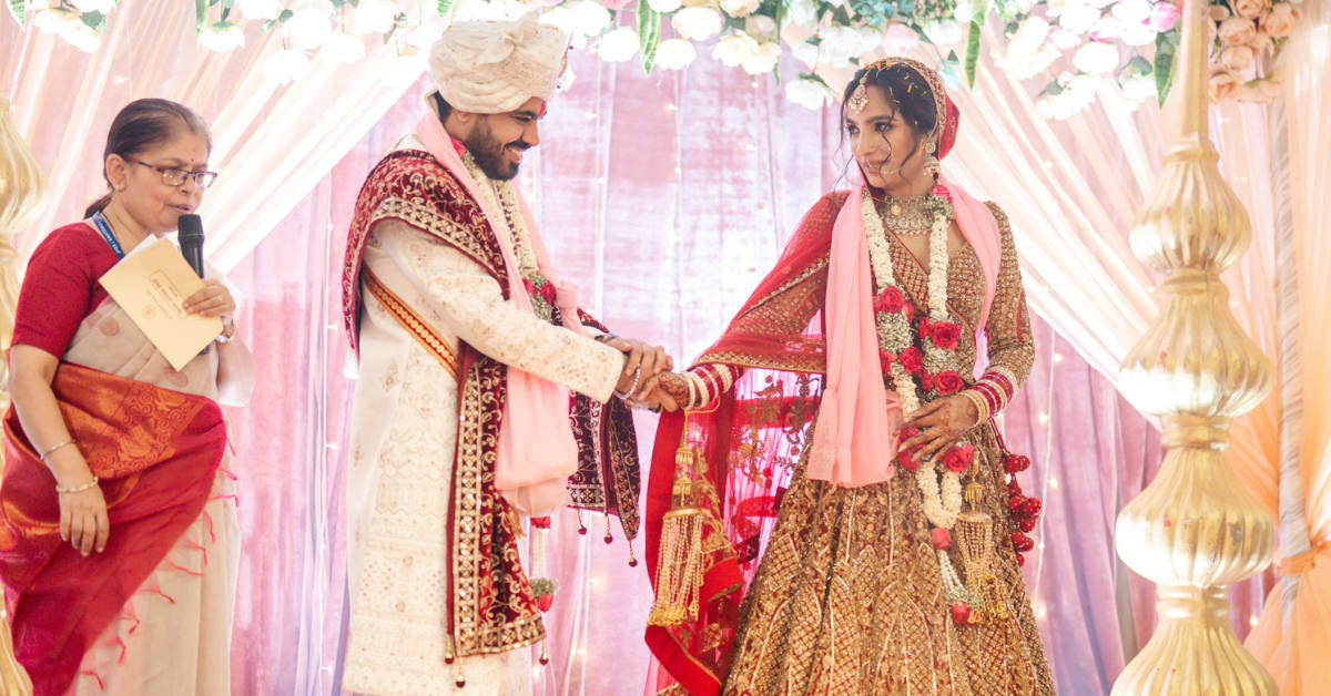 Bride and groom at outdoor wedding venue surrounded by natural greenery in Mumbai