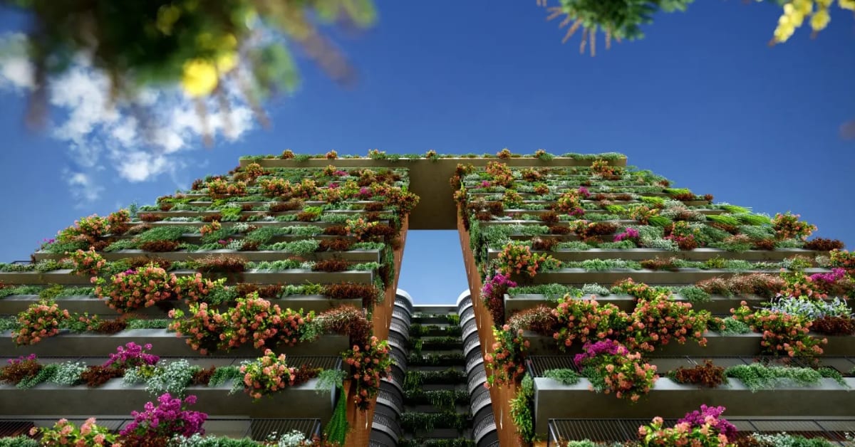Multi-story residential building in Kerala covered with lush gardens on alternating floors creating vertical forest appearance