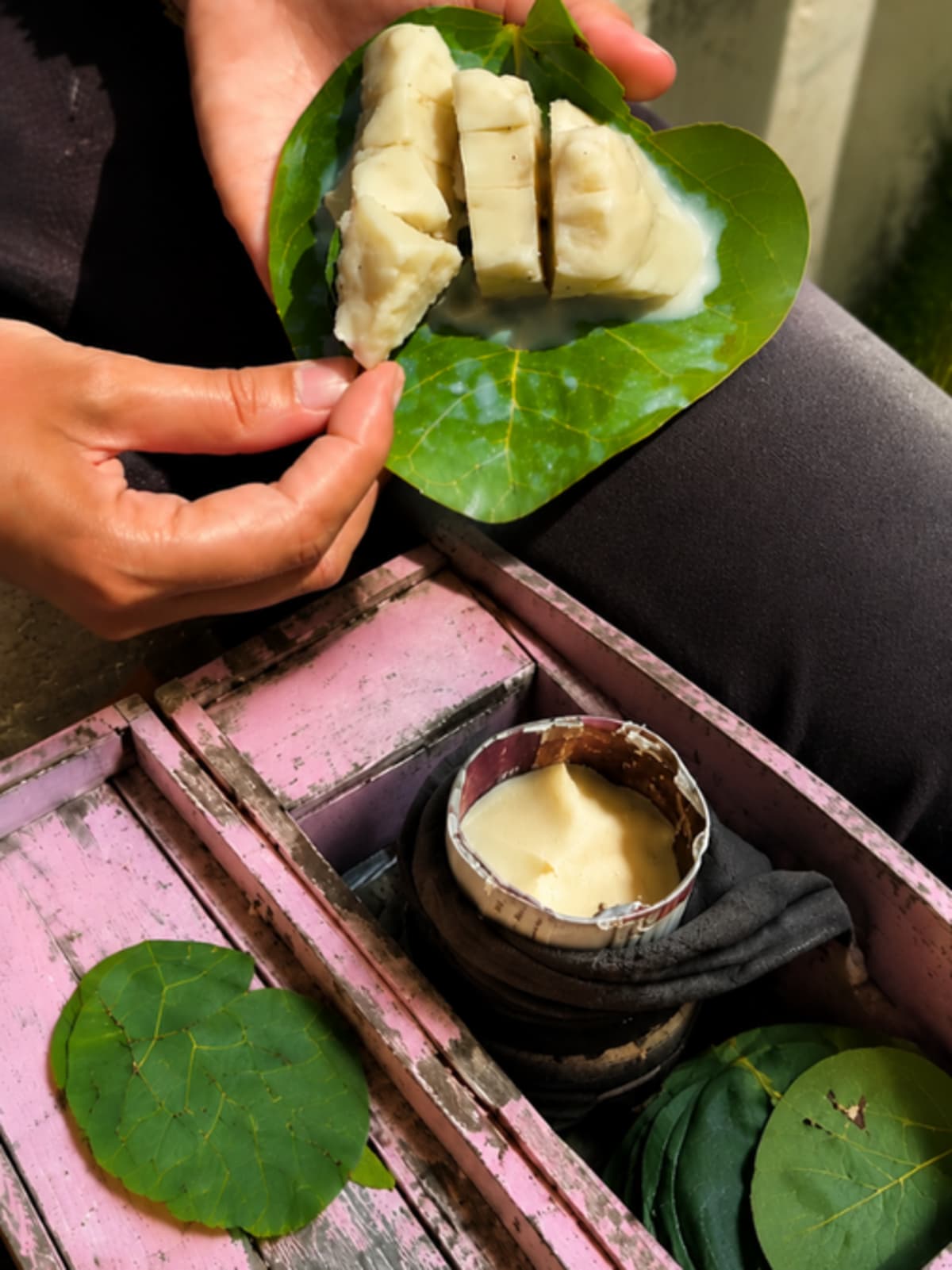 Golden brown caramelized milk dessert Malai Baraf served on traditional green leaf