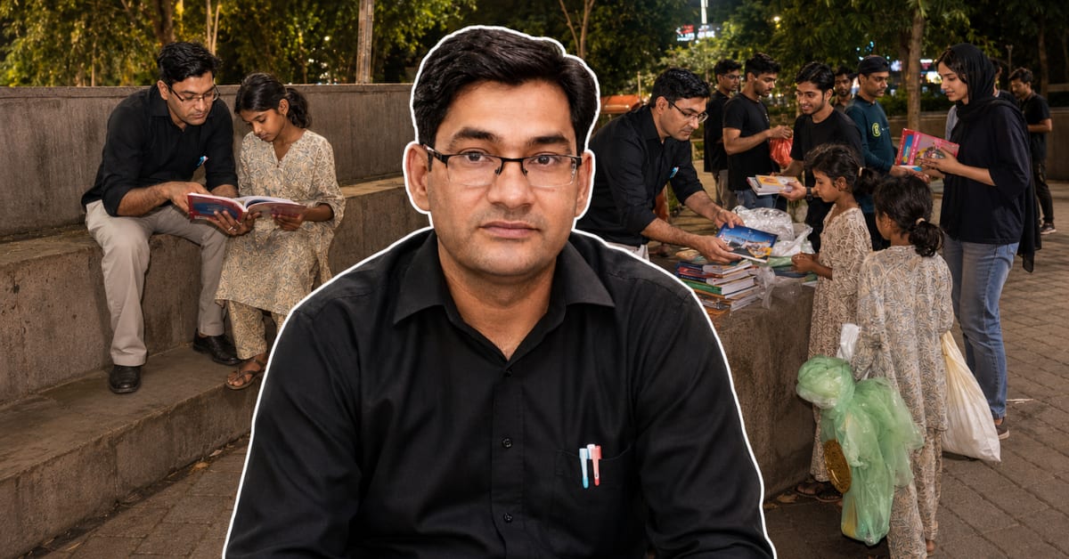 Delhi teacher Krishna Kumar teaching street children on sidewalk classroom in Sheikh Sarai