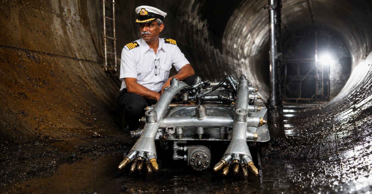 Hydraulic robot navigating inside large petroleum storage tank removing sludge remotely