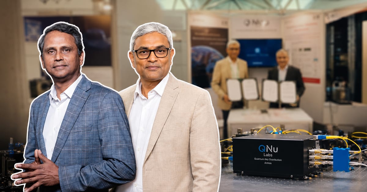Two Indian engineers working on quantum cybersecurity technology in Bengaluru laboratory setting