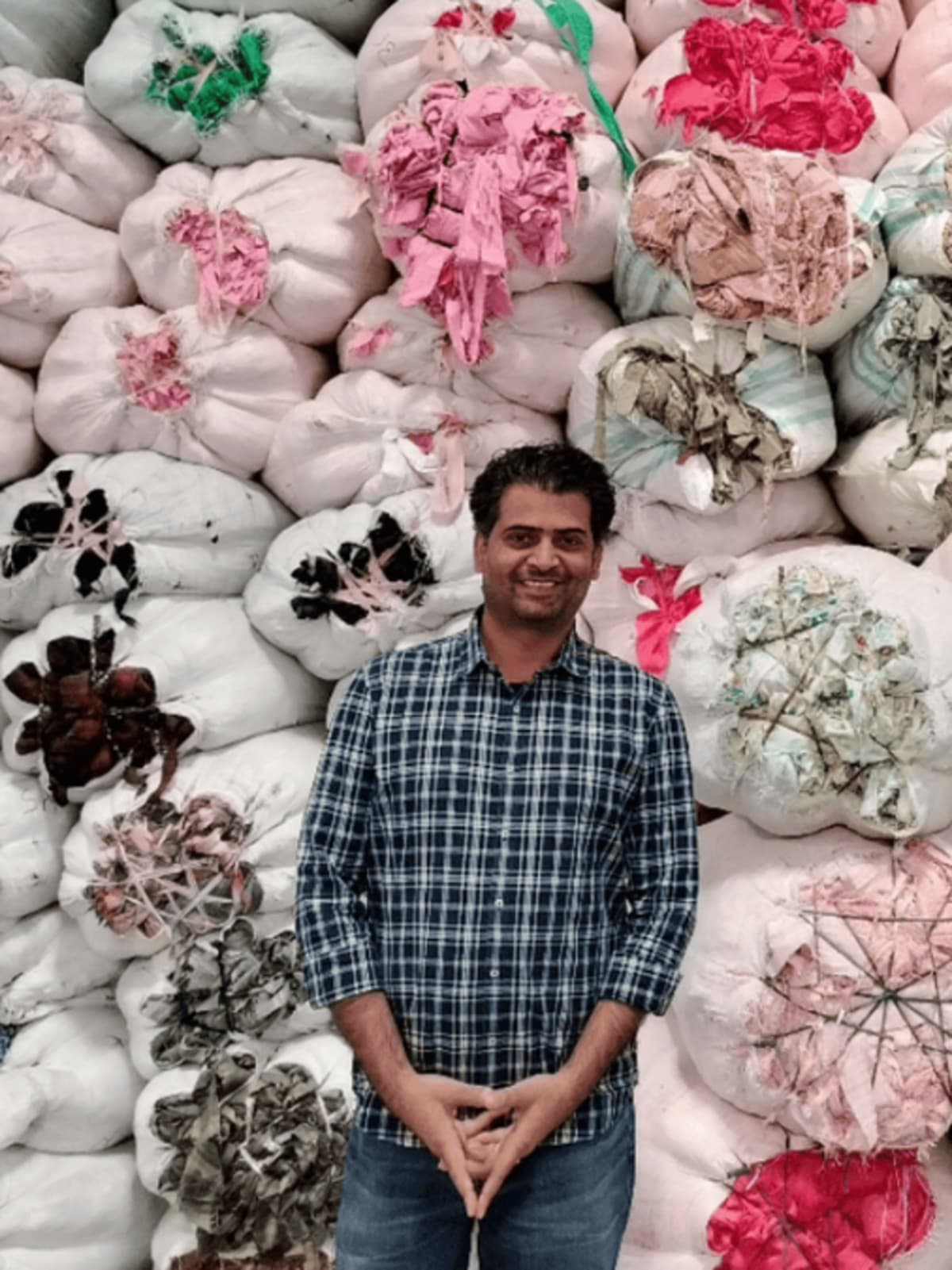 Colorful fabric scraps and textile waste being sorted for recycling and upcycling