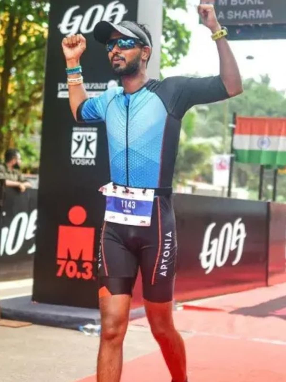 Akshay Sharma crossing the Ironman Malaysia finish line after completing triathlon