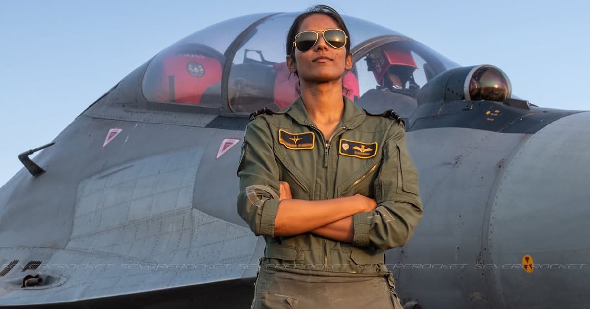 Squadron Leader Bhawana Kanth in flight suit standing beside Indian Air Force fighter jet