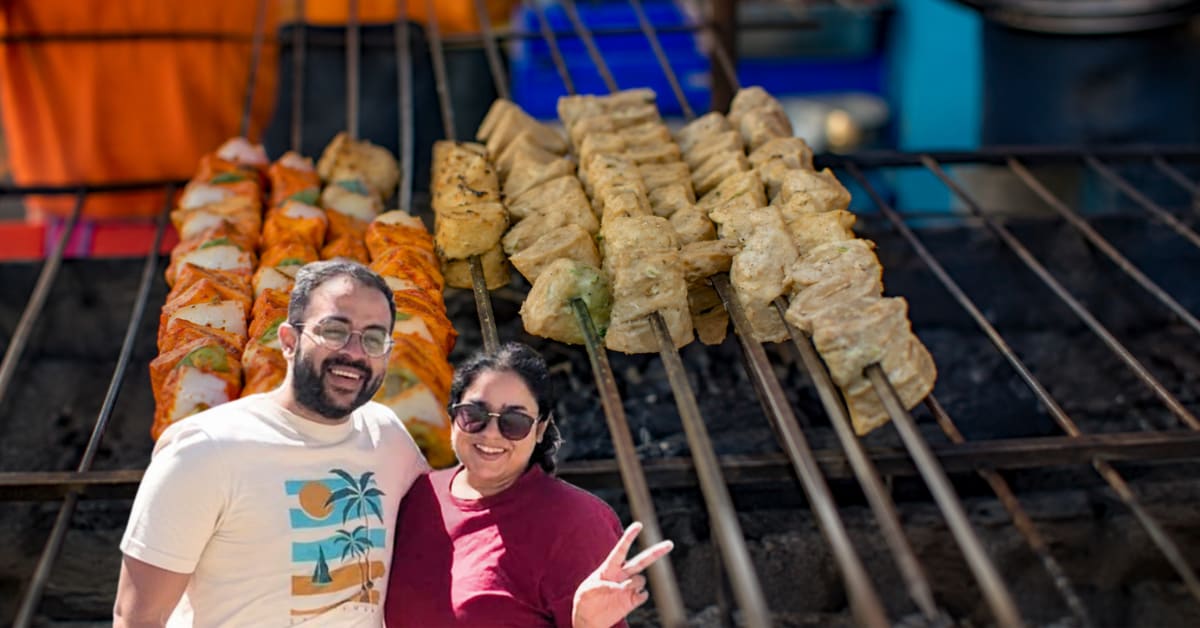 Delhi couple Prashant and Disha holding plates of their protein-rich soya chaap from Protein Pantry