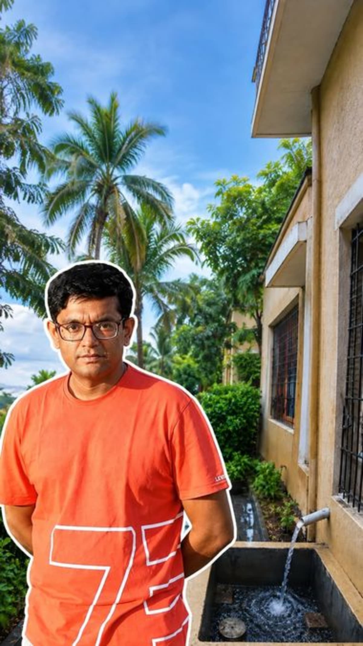 Man standing beside restored borewell with clear water flowing in Mumbai neighborhood garden