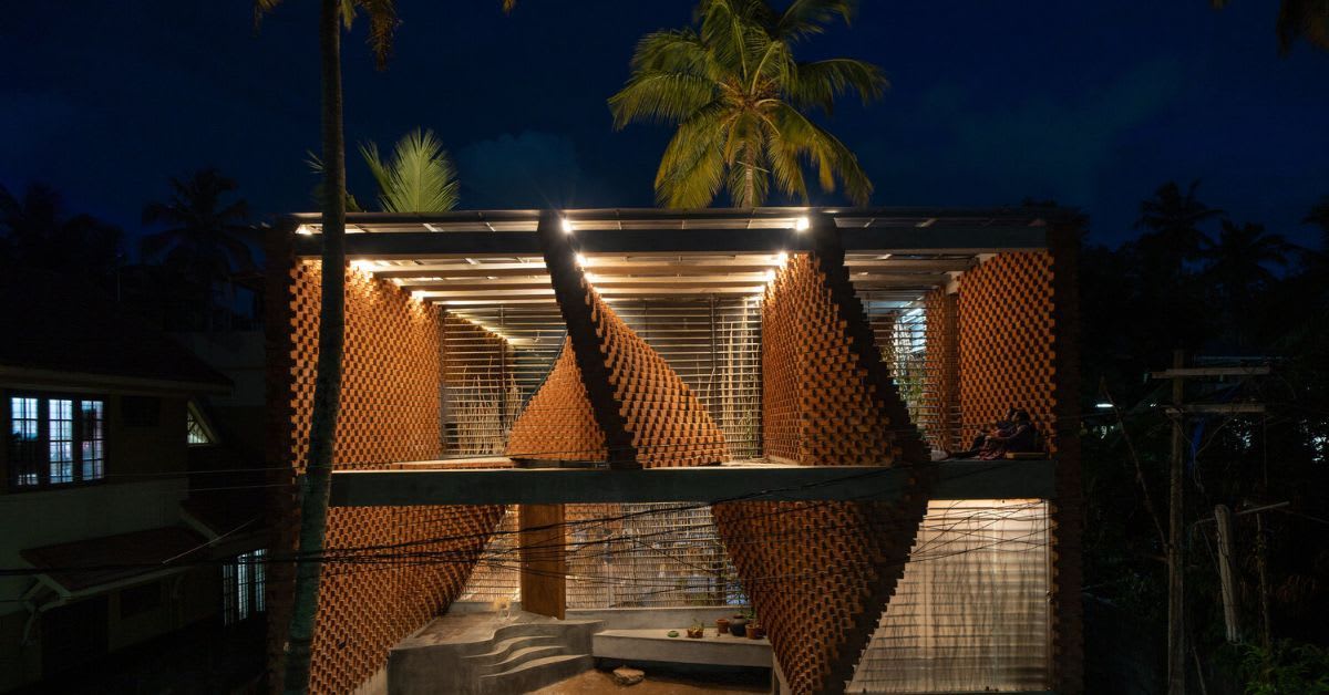 Eco-friendly Kerala home featuring unique slanting brick walls that naturally cool interior spaces