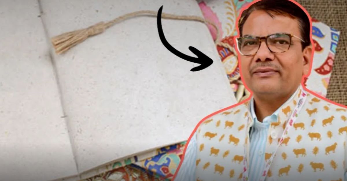 ** Bhim Raj Sharma holding sheets of eco-friendly paper made from cow dung in Jaipur workshop