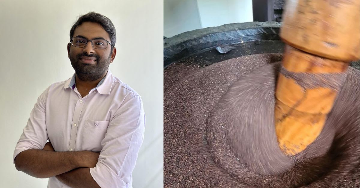 Traditional stone mill crushing seeds to extract cold-pressed oil in Tamil Nadu facility