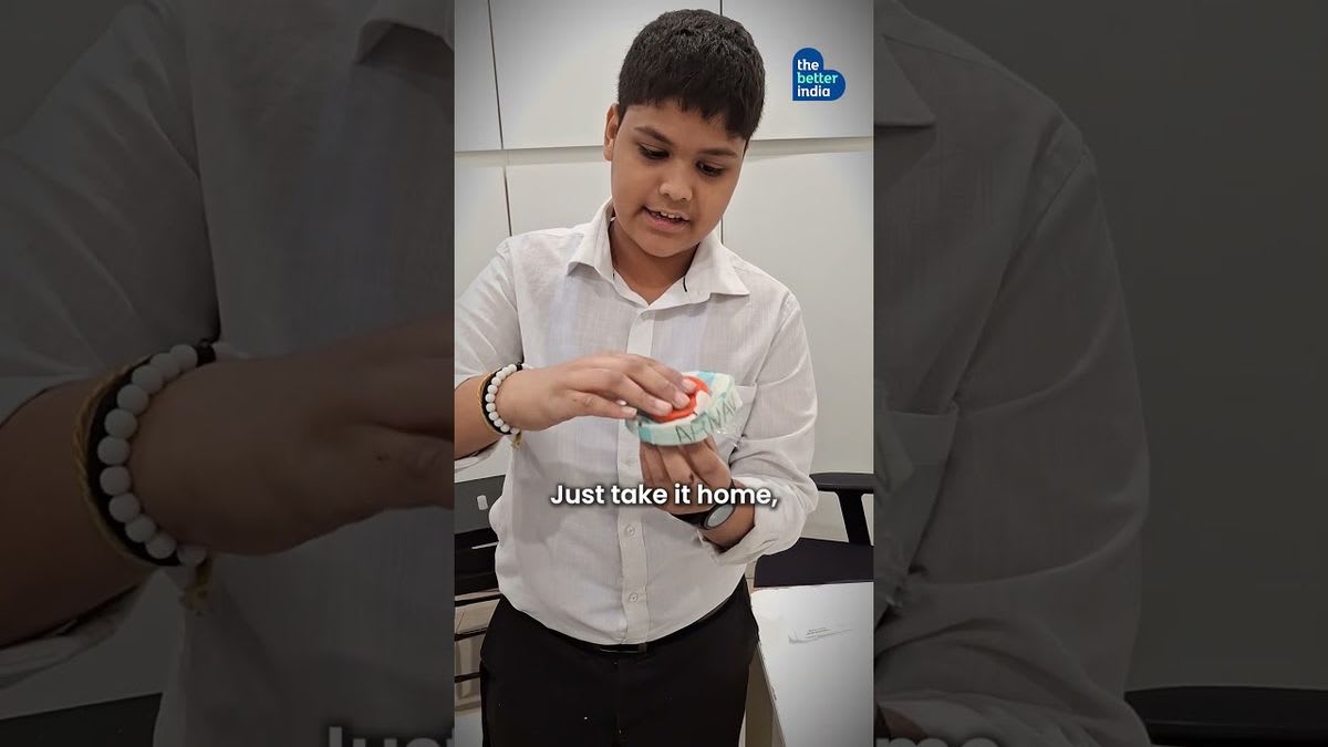 Indian students holding a small pocket-sized spittoon device designed to prevent public spitting and disease spread