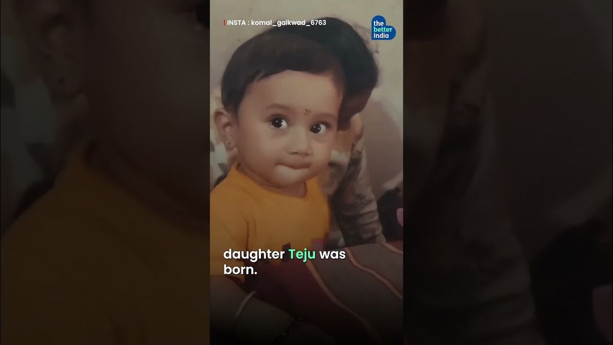 Indian woman driving auto rickshaw in Mumbai with young daughter sitting safely beside her