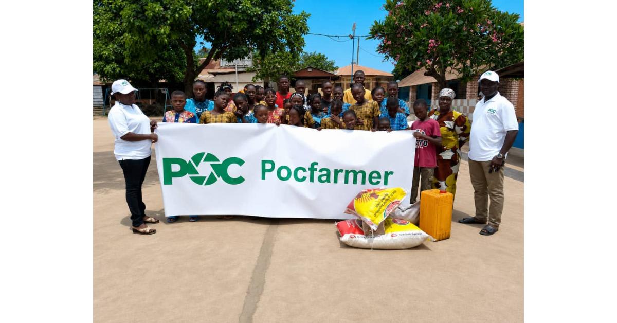 ** Pocfarmer representative presents educational supplies to children during community outreach event in Africa