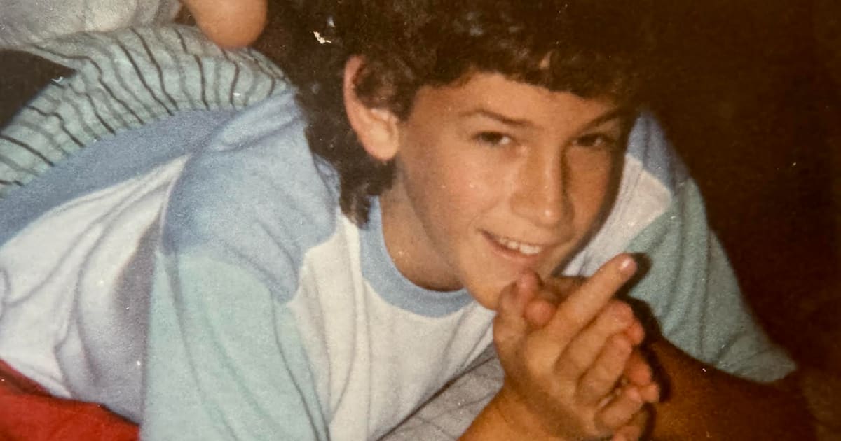 Young Brad Snyder at age 8 in his childhood bedroom on Long Island, New York