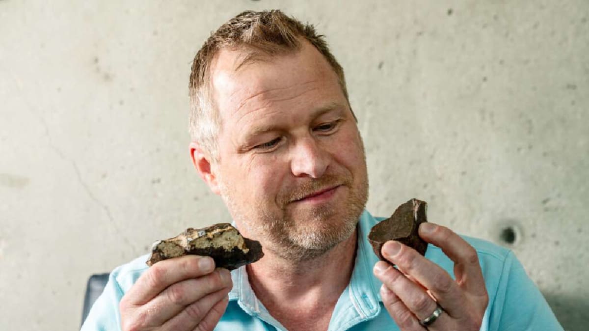 Fist-sized grey meteorite fragment displayed at University of Utah geology building