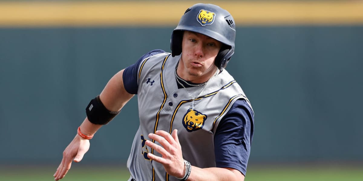 College baseball players on field during extra-inning game between Northern Colorado and St. Thomas