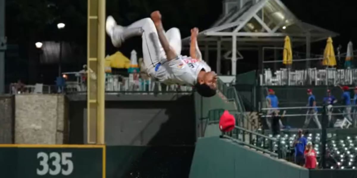 Baseball pitcher Alfred Morillo performing backflip on mound after clinching playoff victory
