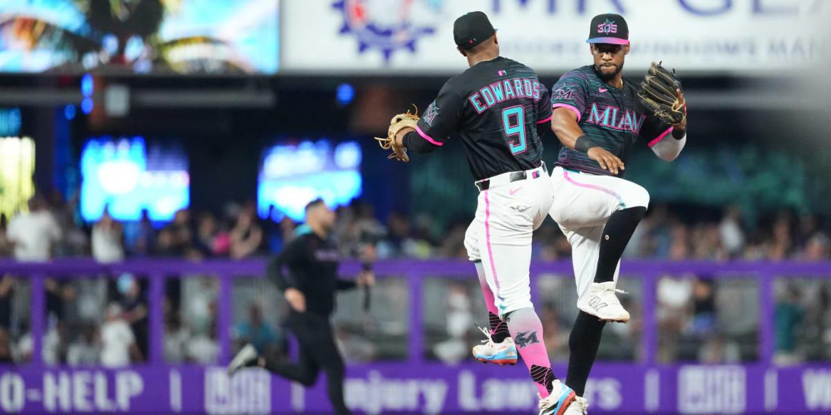 Miami Marlins middle infielders Xavier Edwards and Otto Lopez celebrating during baseball game