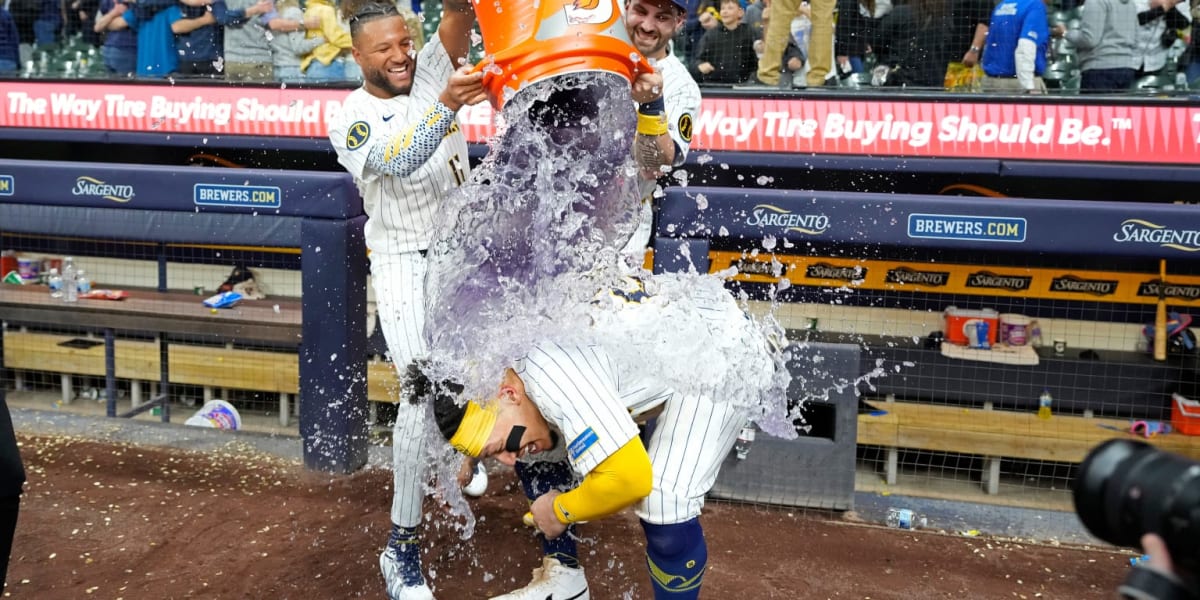 William Contreras celebrating at home plate after hitting game-winning sacrifice fly for Milwaukee Brewers