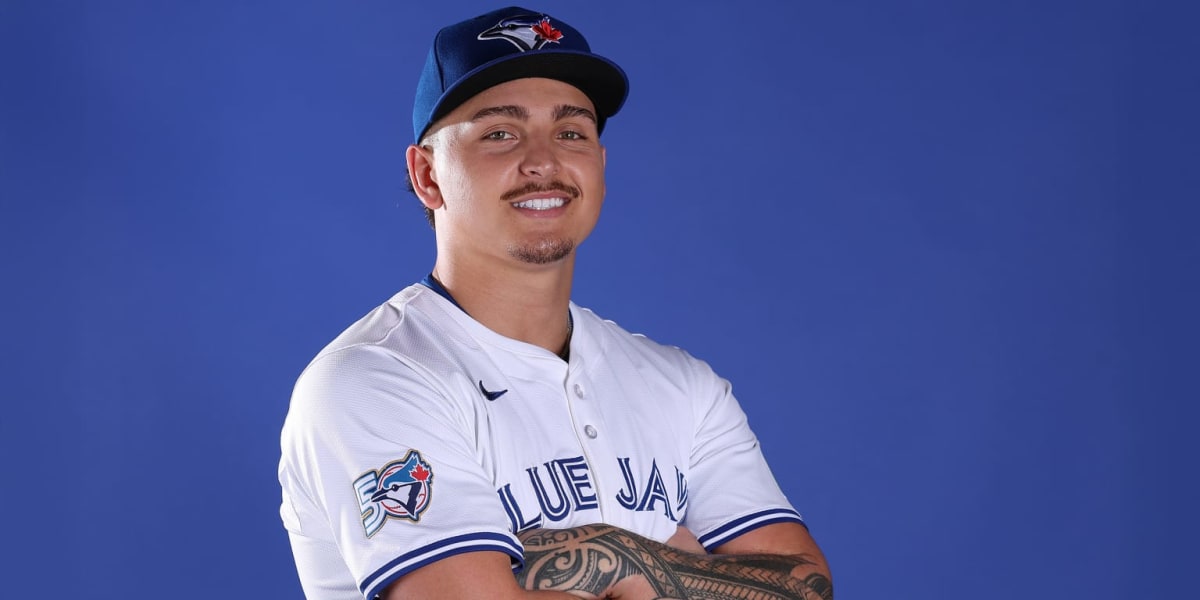 Young baseball pitcher Ricky Tiedemann throwing from the mound in Blue Jays uniform