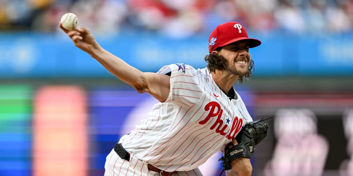 Aaron Nola pitching in Phillies uniform wearing Lou Gehrig Day No. 4 patch