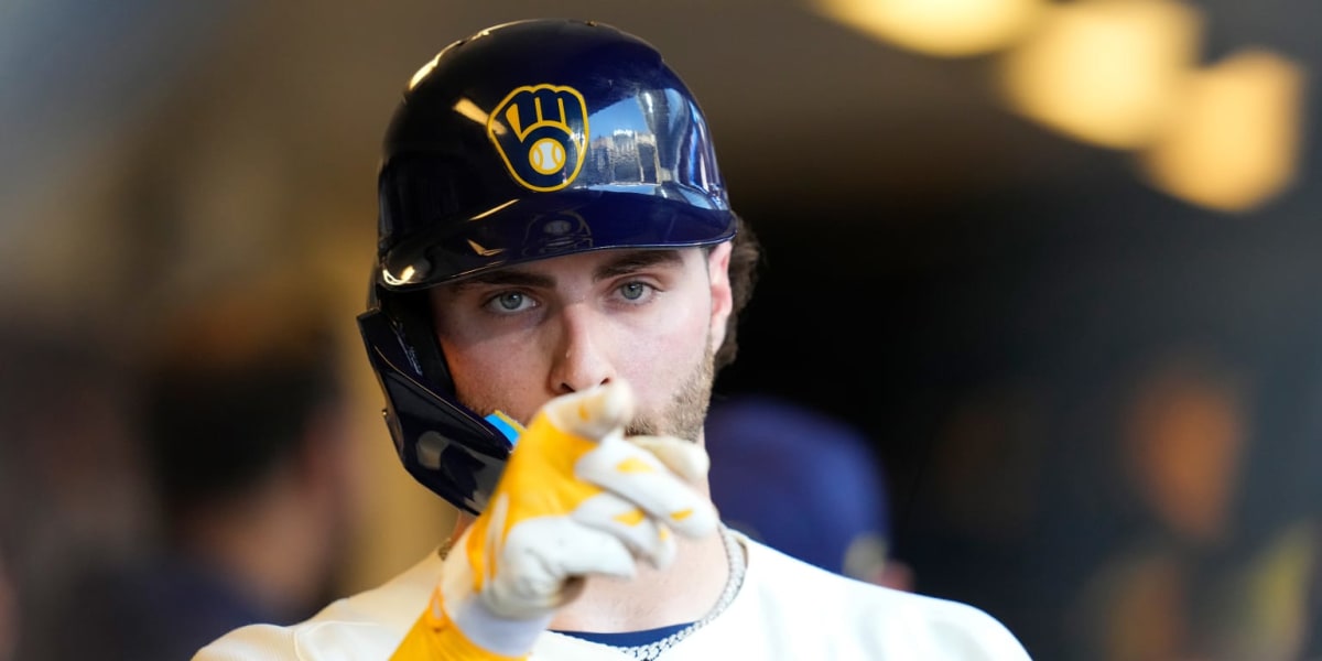 ** Milwaukee Brewers players celebrating dramatic eighth inning comeback victory at American Family Field