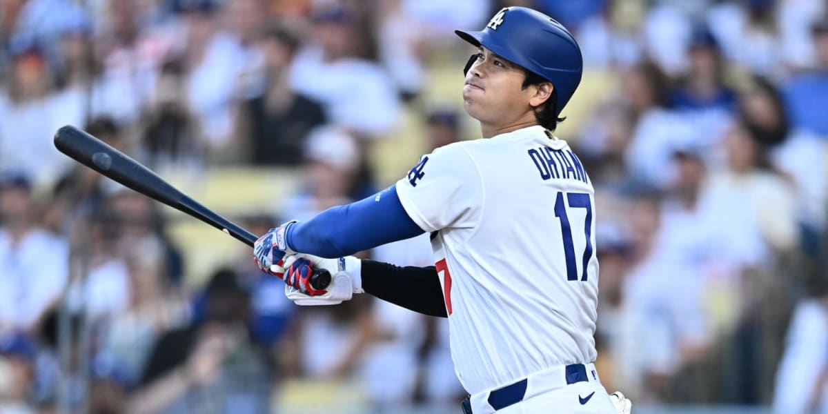 ** Shohei Ohtani in Dodgers uniform rounding bases after hitting home run at Dodger Stadium