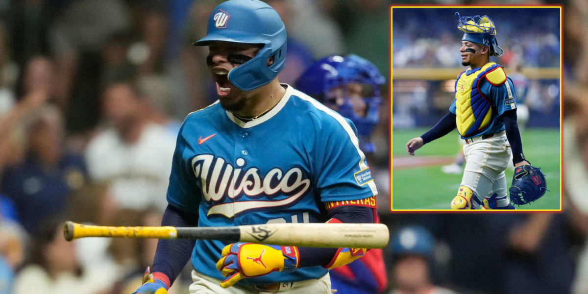 William Contreras in Venezuelan flag colored baseball gear pointing to sky after home run