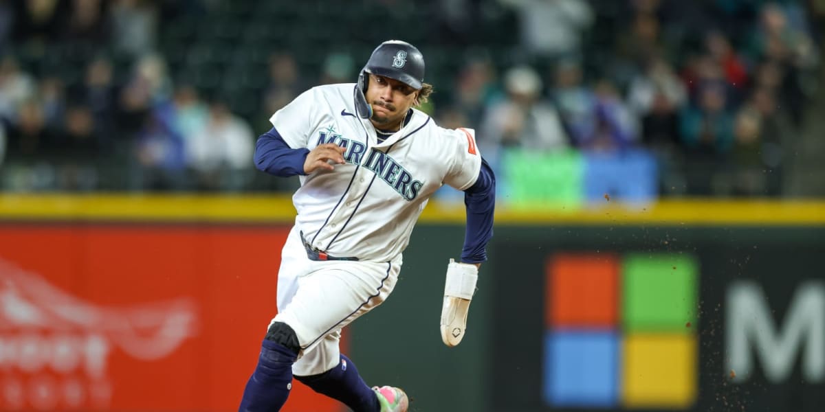 Seattle Mariners players celebrating on field after walk-off win against Oakland Athletics