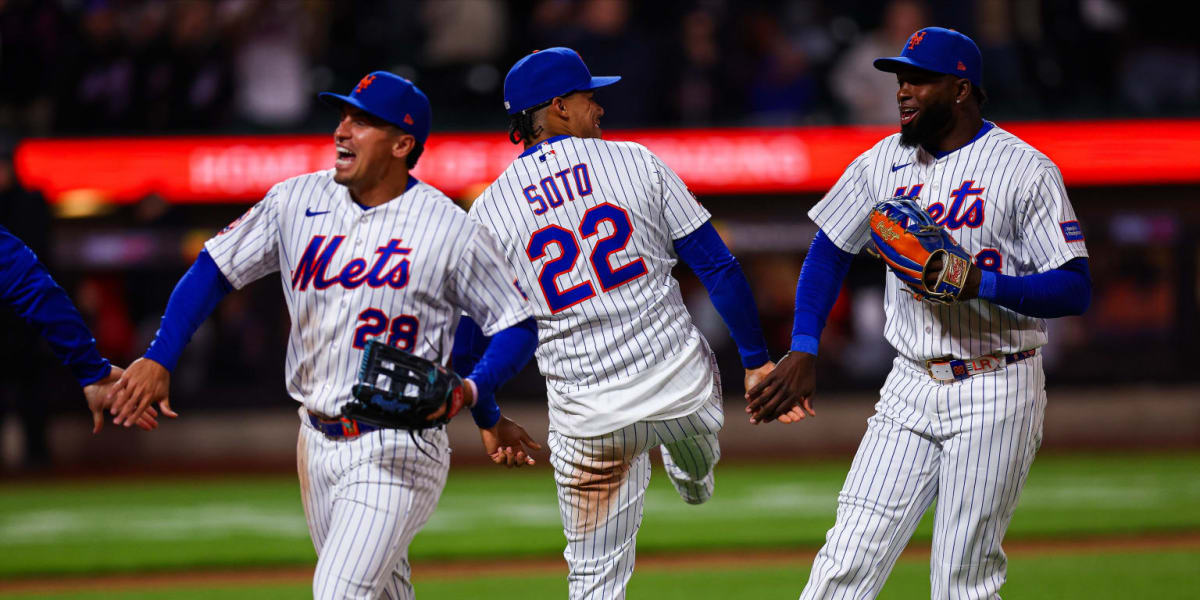 New York Mets players celebrating on field after ending twelve game losing streak