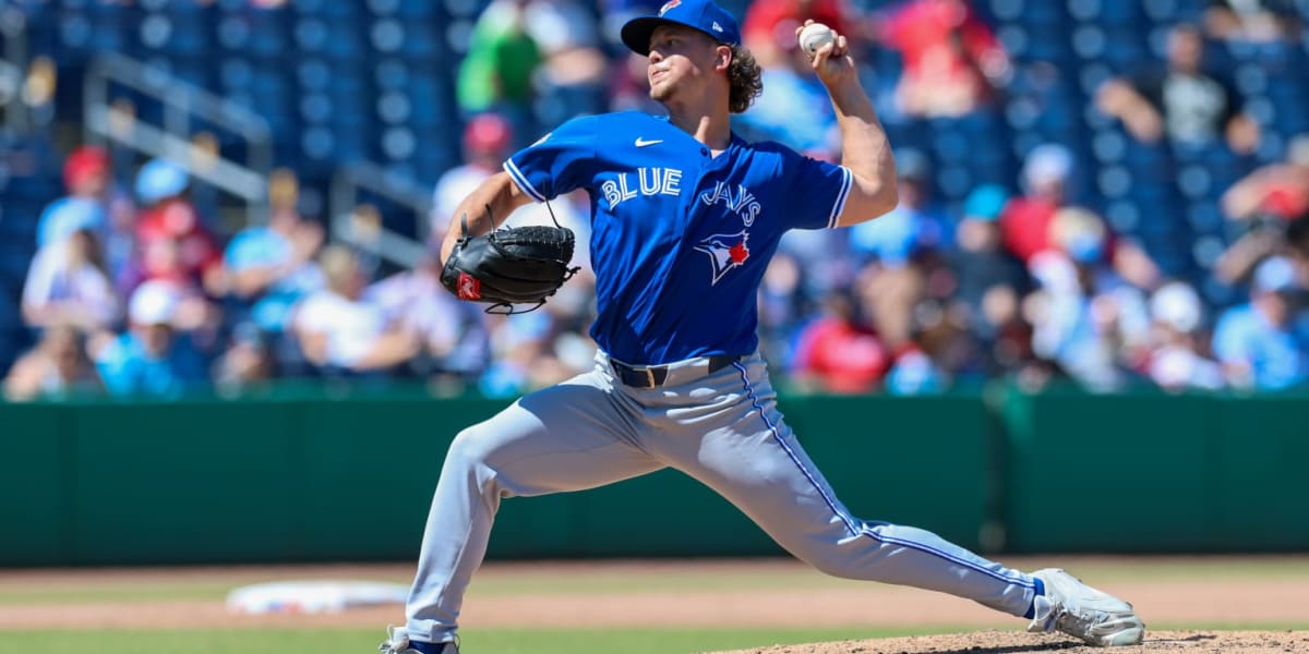Blue Jays pitcher Adam Macko in uniform preparing to pitch during his historic MLB debut