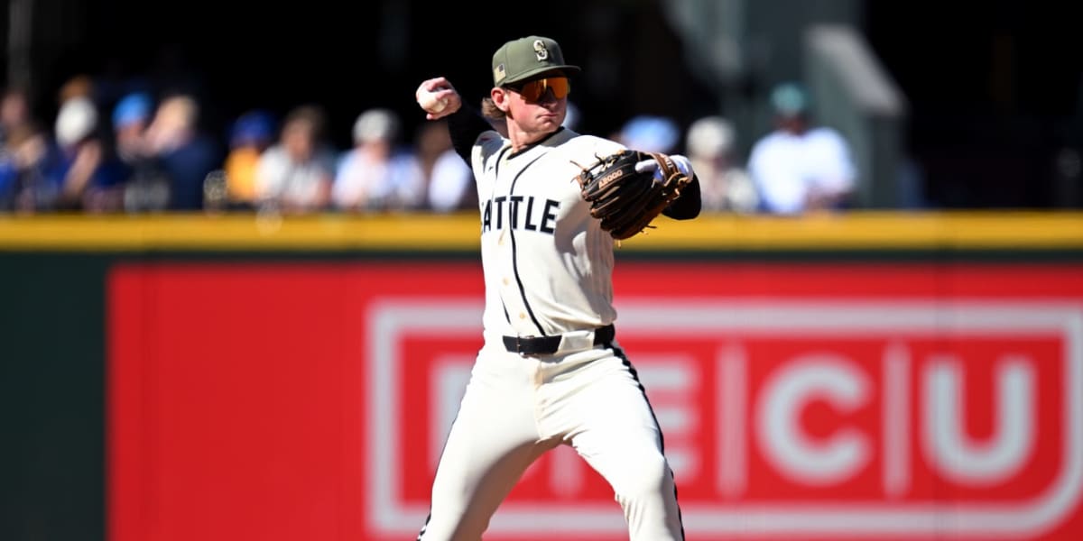 Young baseball player Colt Emerson in Seattle Mariners uniform at bat during his major league debut
