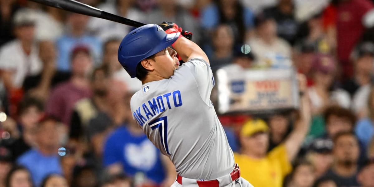 ** Kazuma Okamoto swinging bat at Fenway Park making record-breaking home run contact