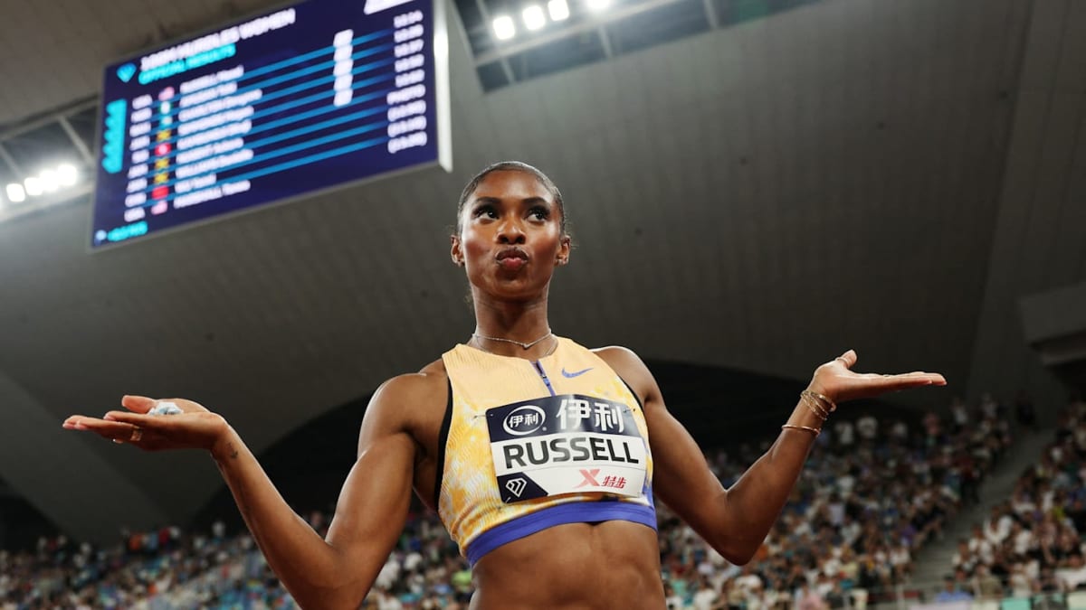 Masai Russell crossing finish line in 100m hurdles race at Xiamen Diamond League