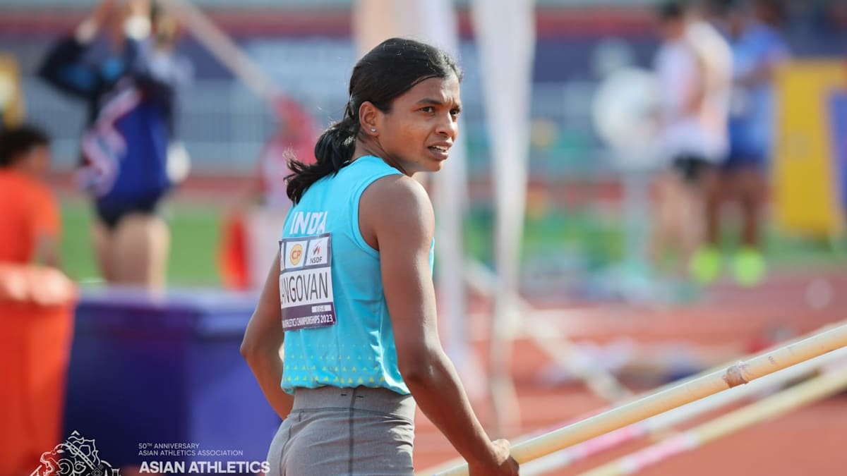 Athlete Baranica Elangovan celebrating after clearing the pole vault bar at indoor track championship