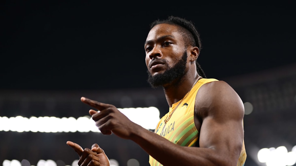 Jamaican sprinter Kishane Thompson crossing finish line at Florida track meet in celebration