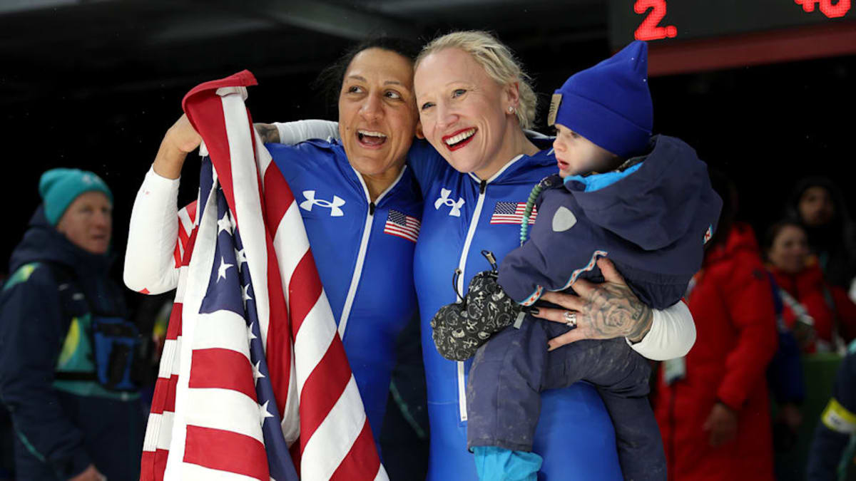 Elana Meyers Taylor signing to her young son after winning Olympic gold medal