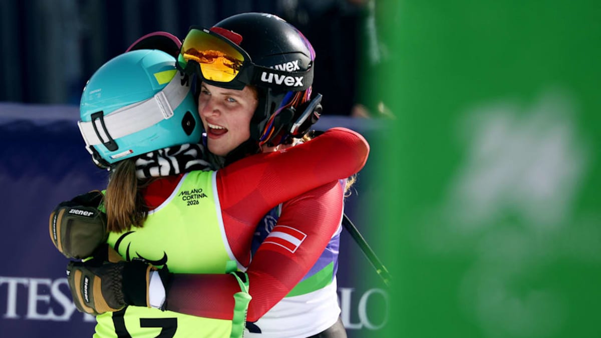 Para alpine skier celebrating with female family member at Milano Cortina 2026 Paralympics