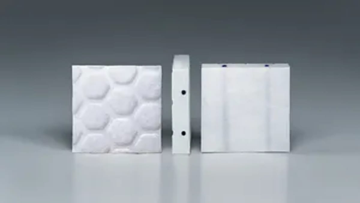 Small tile-shaped medical implants placed in brain cavity during tumor removal surgery