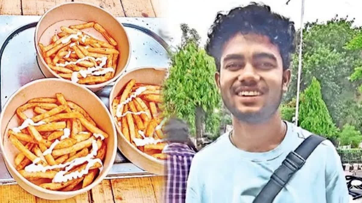 Young Indian entrepreneur Surya Swaroop at his roadside chicken fries stall in Visakhapatnam