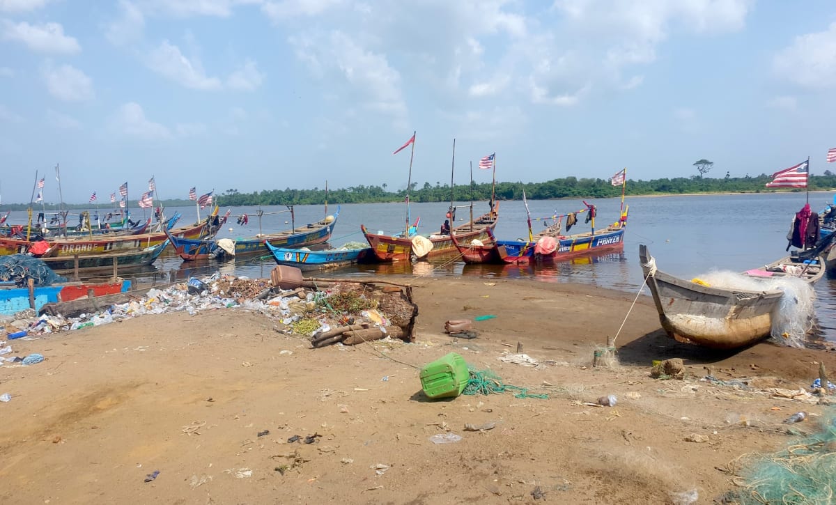Traditional fishing canoes lined up on African shore after day's fishing operations
