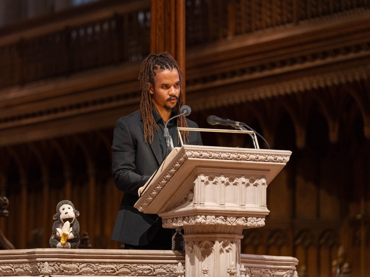 Merlin Van Lawick speaking at podium during Jane Goodall's celebration of life ceremony