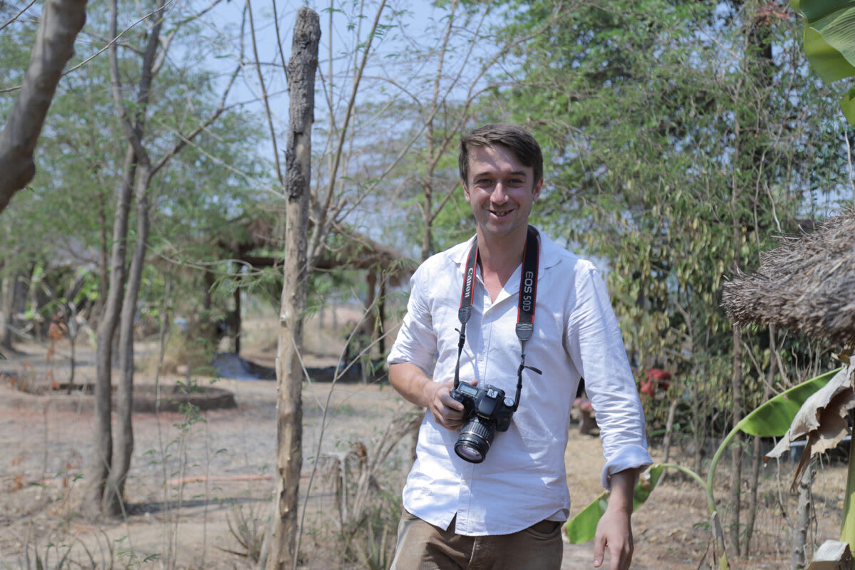 Journalist documenting environmental issues on river in Southeast Asia's Mekong region