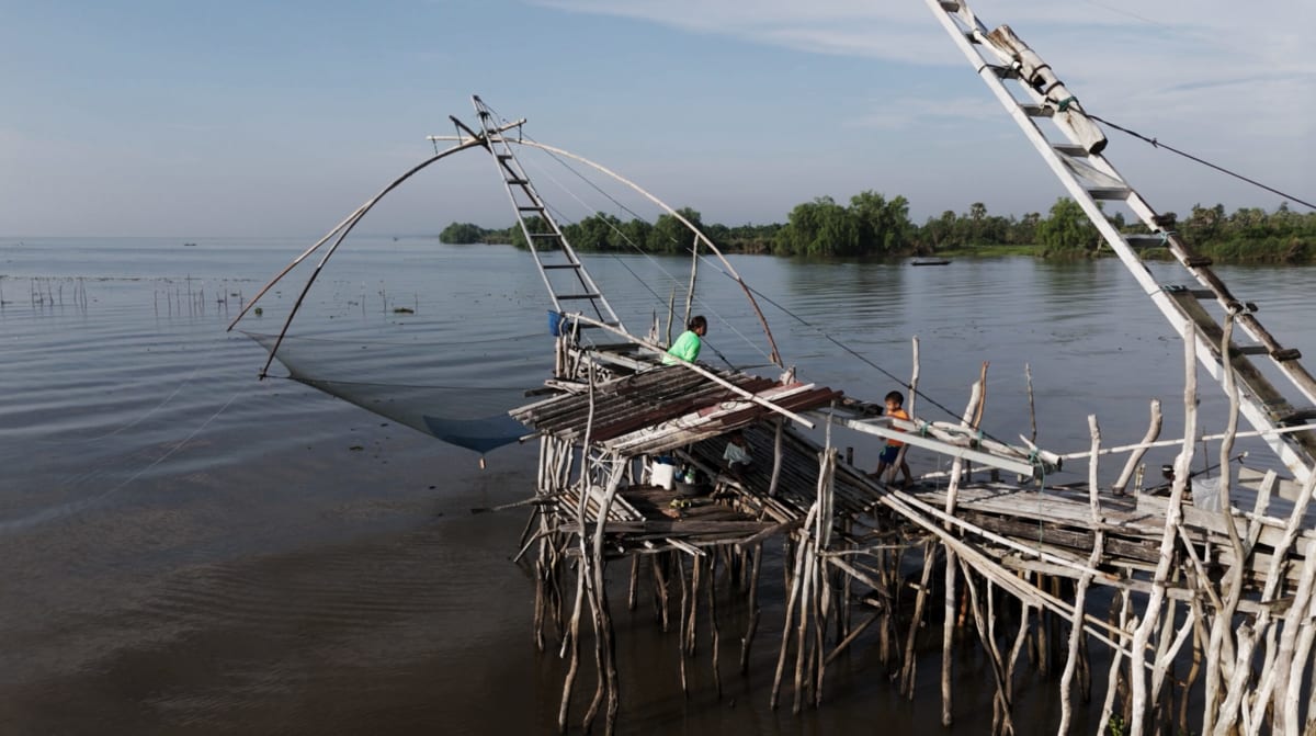 Large traditional Yo Yak fishing net structure standing in Songkhla Lake, Thailand waters