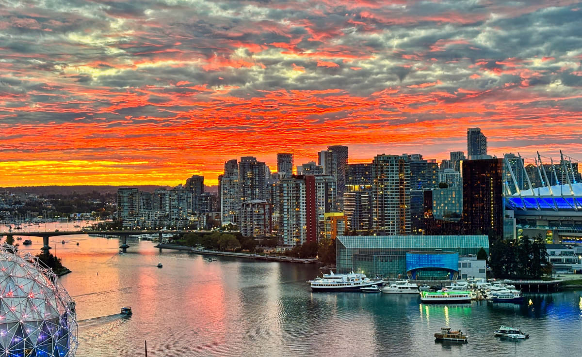 Aerial view of False Creek tidal inlet winding through downtown Vancouver's waterfront buildings