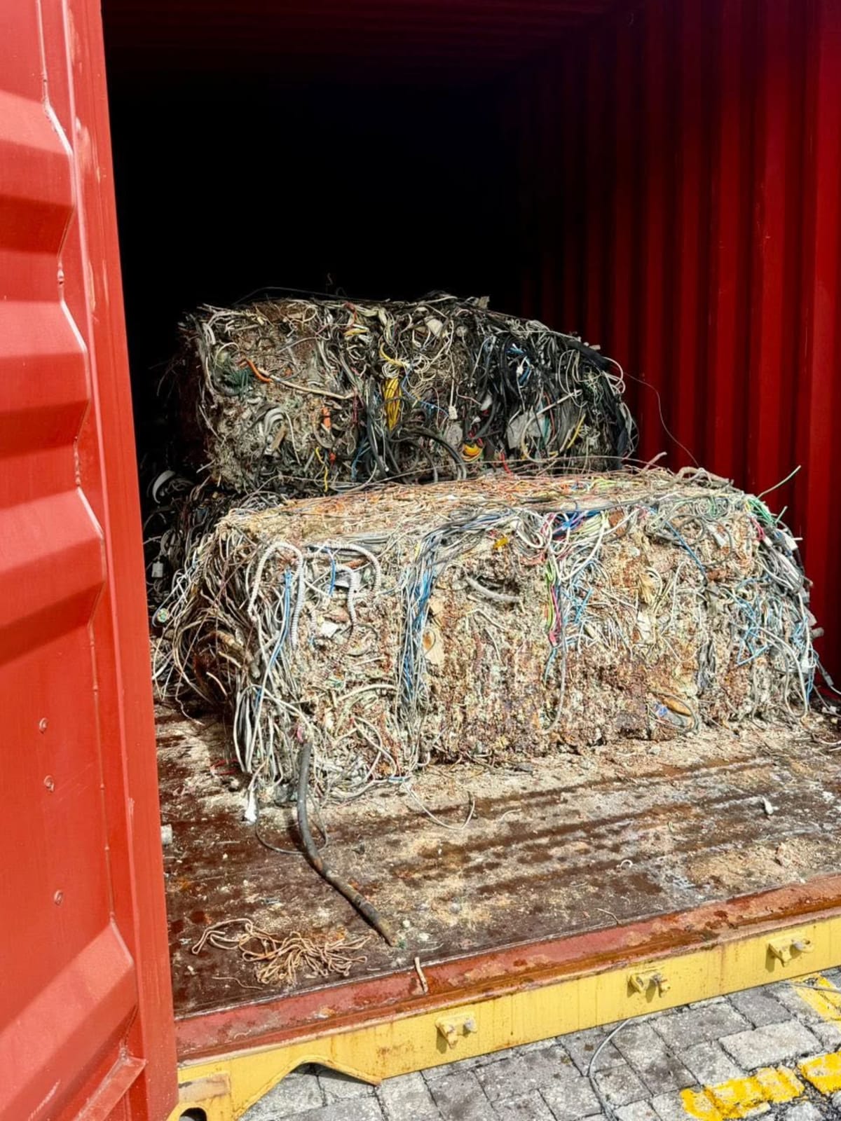 Bundles of electrical wire scrap inside intercepted shipping container at Malaysian port
