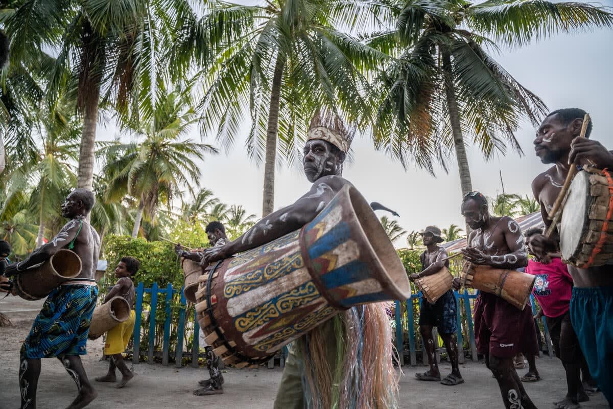 Indigenous representatives from Raja Ampat gathering together in traditional dress on Arborek Island